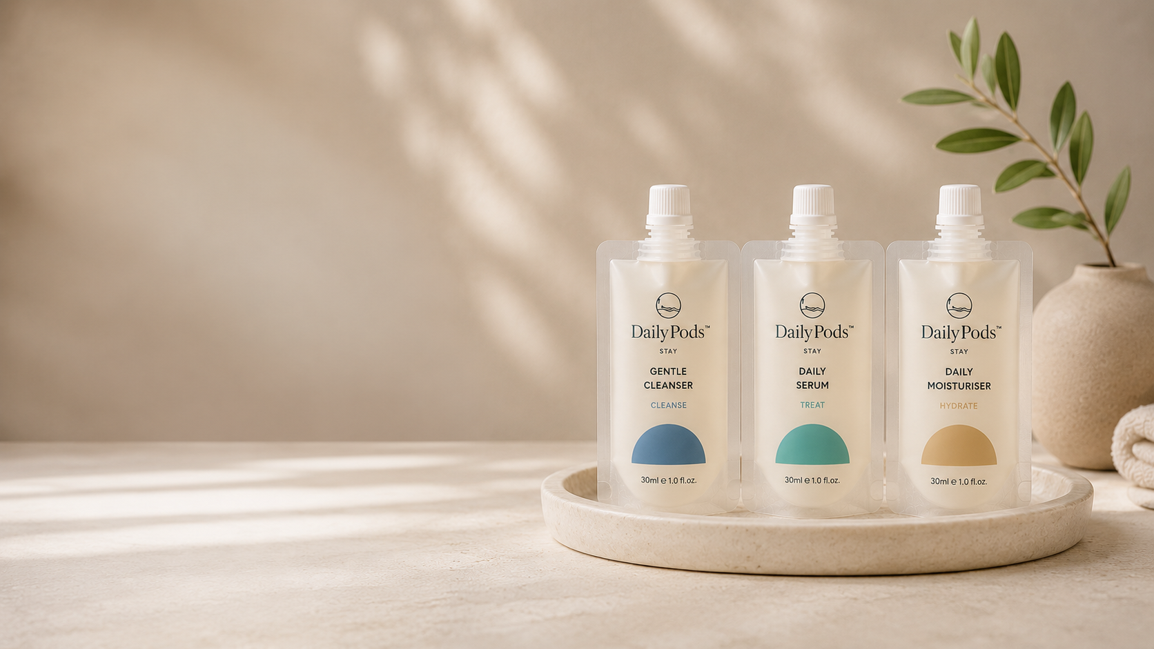 DailyPods cleanser, serum, and moisturiser pouches displayed on a tray